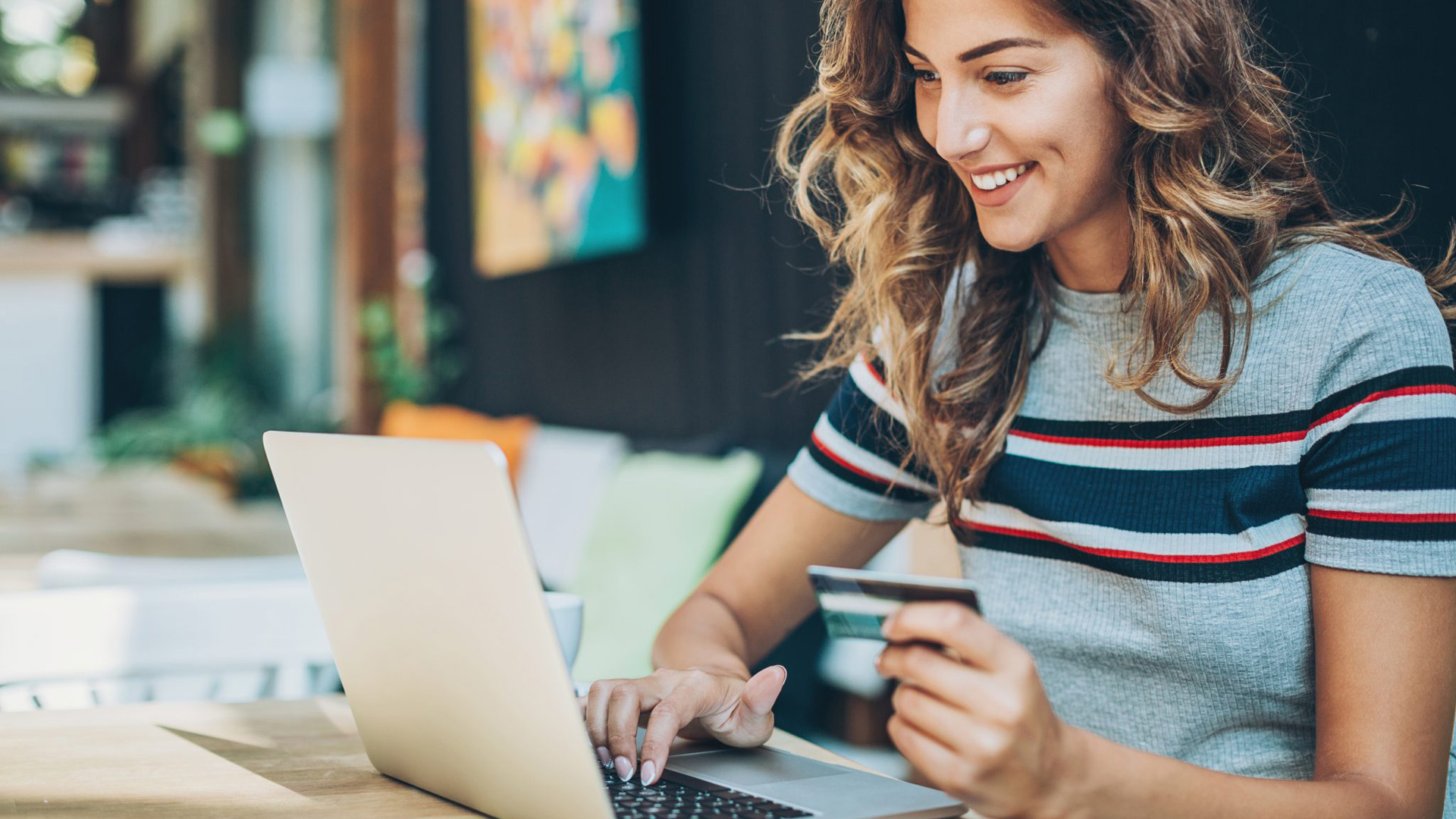 Woman Buying Holiday Via Merchant Services