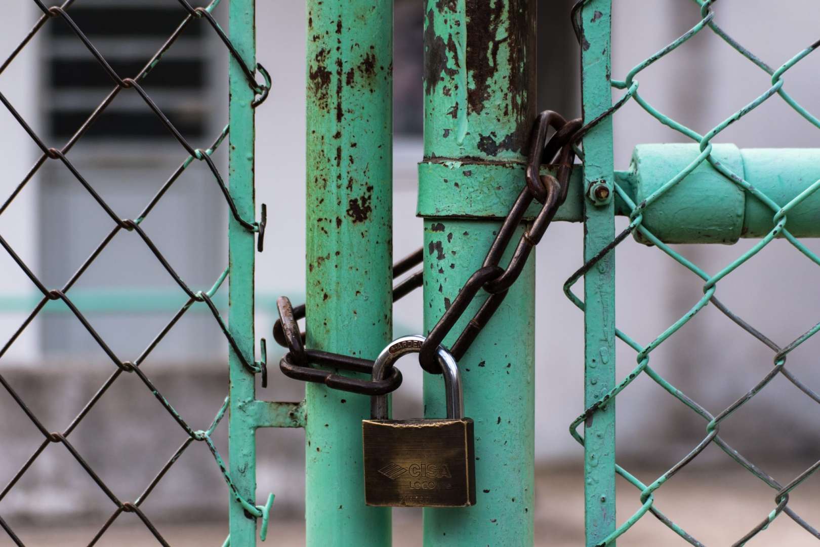 Padlock and Chain Securing a Business Entrance
