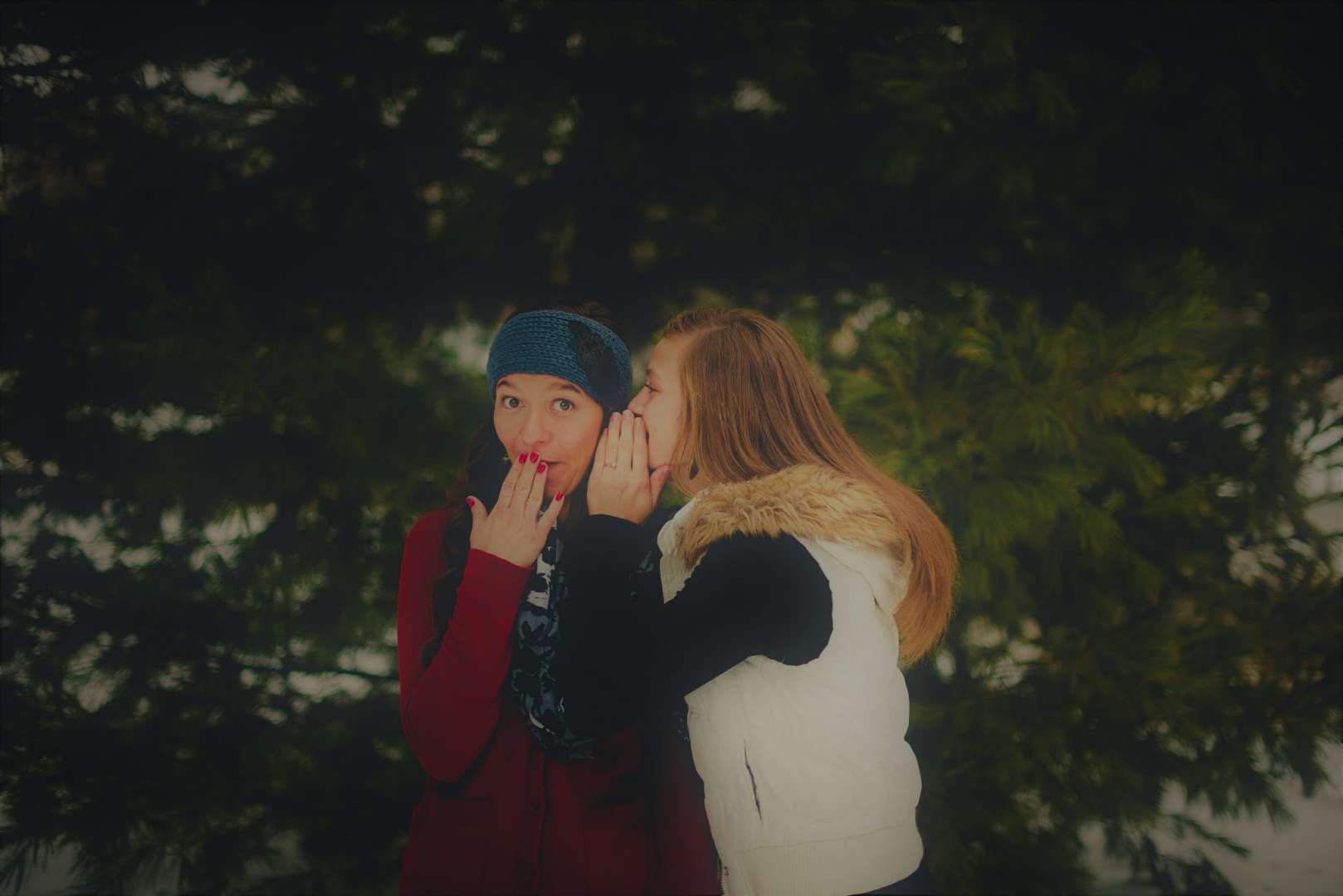 Two Girls Whispering Secrets