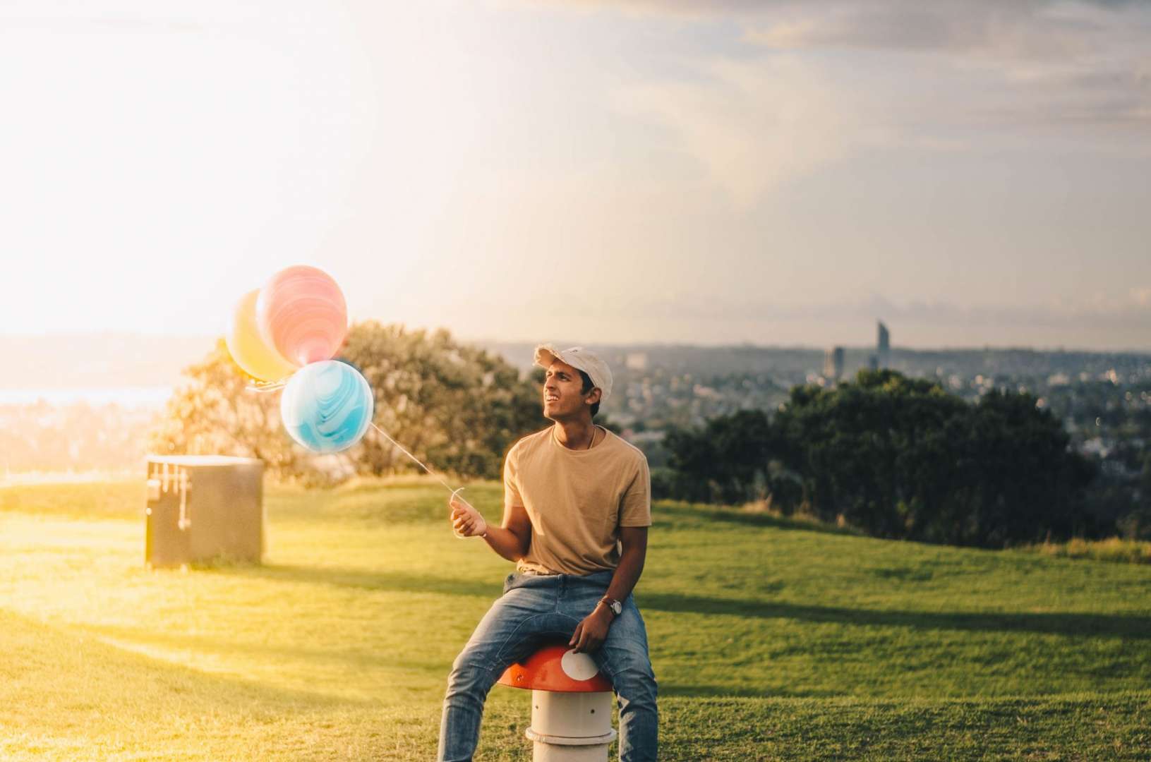 Man Holding Balloons