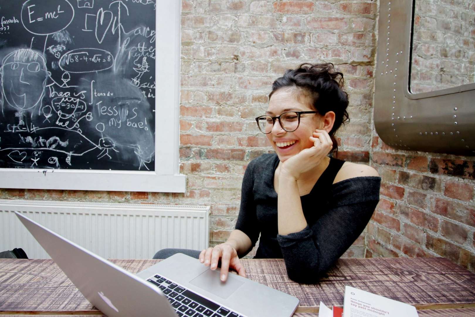 Woman Starting a Travel Business From Her Laptop